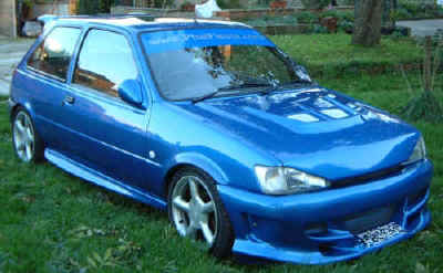 Animal front bumper, RS2000 skirts, EVO 5 bonnet vent, Mondeo Est rear spoiler, and DTM mirrors